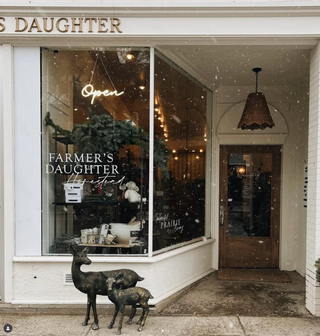 Local Swift Current Storefront with 'Farmer's Daughter' branding and decorative elements.