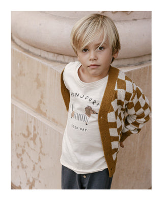 Close up of a little boy wearing Rylee & Cru Boy's Button Cardigan in a checkerboard pattern 